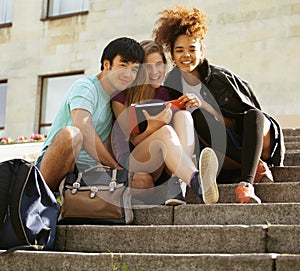 Cute group teenages at the building of university