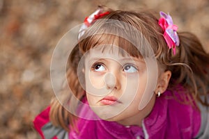 Cute grumpy girl in pink