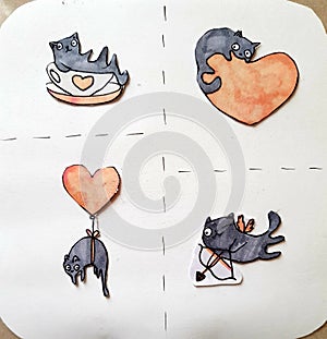 Cute hand drawn doodle cats and hearts on paper.