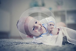 Cute happy baby boy portrait. Close up.