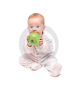 Cute happy baby eats fruit green apple isolated photo