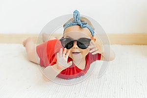 Cute happy baby girl in sunglasses