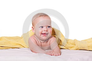 Cute happy baby in towel