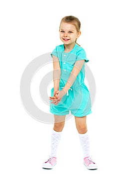 Cute happy blonde little girl raising her hands