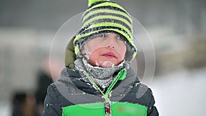 Cute Happy Boy Smiling with a Snowy Face