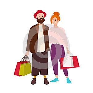 Cute happy couple carrying shopping bags. Smiling man and woman holding their purchases. Pair of shopaholics. Funny