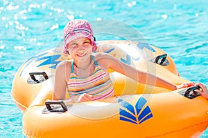 Cute happy girl in amusment aquapark