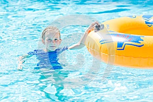 Cute happy girl in amusment aquapark