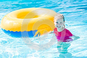 Cute happy girl in amusment aquapark