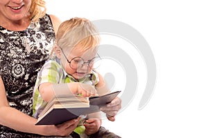 Cute happy kid reading a book