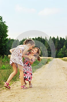 Cute happy kids playing in summer filed photo
