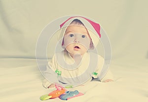 Cute happy newborn baby in christmas hat