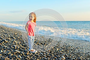 Cute happy smiling little girl on the seaside