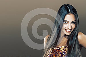 Cute happy young indian real woman in studio close up smiling, f