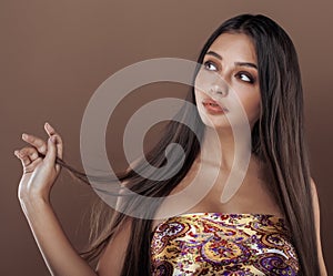 Cute happy young indian woman in studio close up