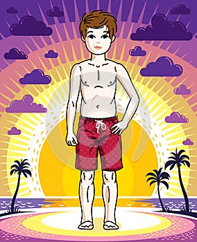 Cute happy young teen boy posing wearing fashionable beach short