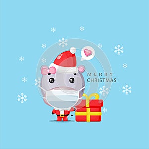 Cute hippo wearing a santa claus costume and a medical mask
