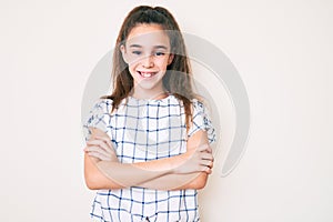 Cute hispanic child girl wearing casual clothes happy face smiling with crossed arms looking at the camera