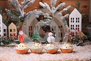 Cute Holiday Cupcakes With Star Sprinkles on Christmas Background