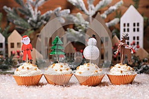 Cute Holiday Cupcakes With Star Sprinkles on Christmas Background