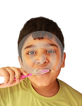 Cute Indian child brushing teeth