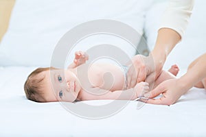 Cute infant lying in bed