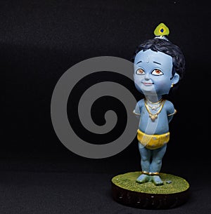 Cute and innocent idol of Hindu God Lord Krishna; right orientation