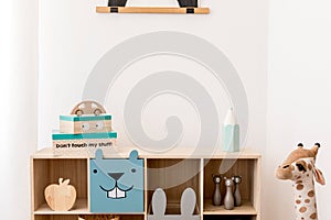 Cute interior of kid room with baby accessories and toys.