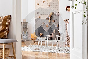 Cute interior of kid room with baby accessories and toys.