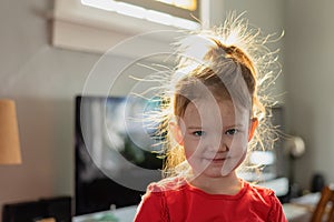 Cute kid with bed head in morning