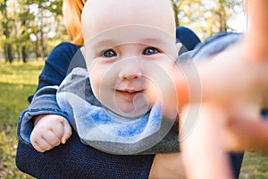 Cute kid with blue eyes in blue sweater