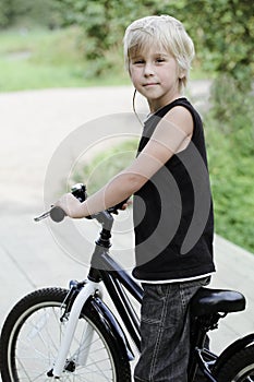 Cute kid, boy and bicycle