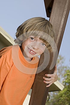 Cute kid climbing a playset photo