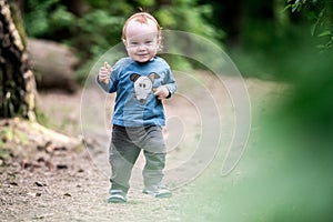 Cute kid eating bread outdoors