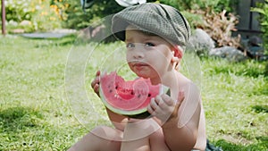 Cute kid eating watermelon outside.