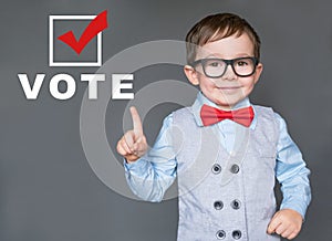 Cute Kid encouraging others to register and vote photo