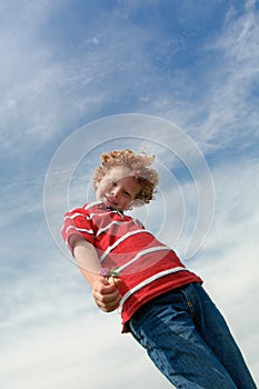 Cute kid giving flower