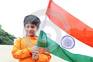 A cute kid holding India flag - Tiranga