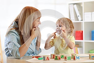 Cute kid little boy at speech therapist office photo