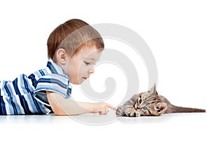 Cute kid lying on floor and playing with cat pet