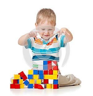 Cute kid playing toy blocks