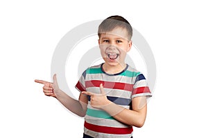 Cute kid pointing with his finger on something, isolated on white background