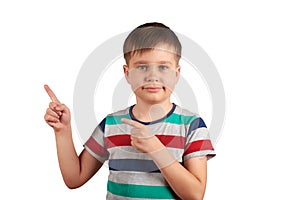 Cute kid pointing with his finger on something, isolated on white background