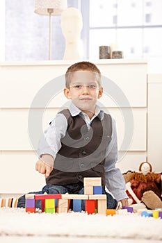 Cute kid proud of building toys