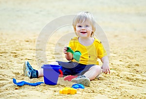 Cute kid in the sandpit photo