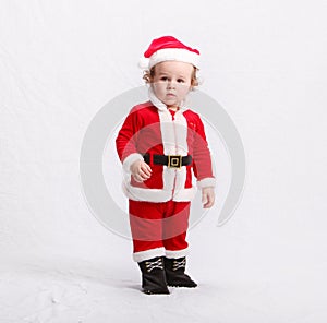 Cute kid in Santa Claus clothes