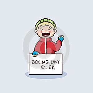 Cute kid with winter clothing holding boxing day sale banner