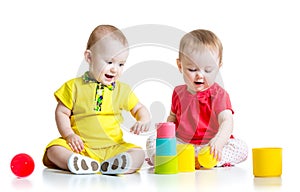 Cute kids playing with color toys. Children girl