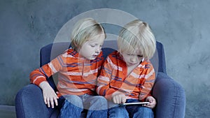Cute Kids Playing Games On Smartphone.
