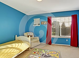 Cute kids room with blue walls.
